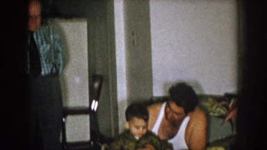 1957: a detailed look at a family of men gathered together covering several