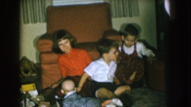 1957: one child, two toddlers and one baby on the living floor near the