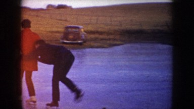1953: man and woman ice skating on frozen pond NORTH DAKOTA