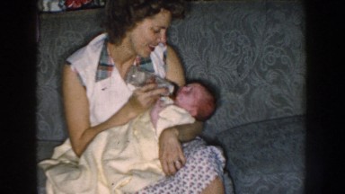 1959: woman feeding baby a bottle NEBRASKA