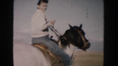 1953: lady having the slow horse ride in lawn with smiling face SOUTH DAKOTA