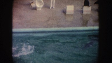 1962: Man Training Seal to Do Water Tricks California