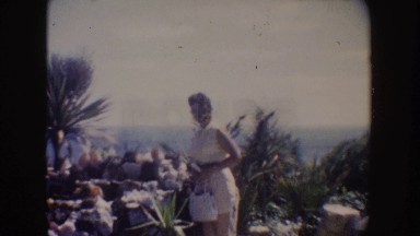 1962: Woman on Vacation Admiring Rock Collection Outdoors in California