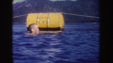 1954: young boy enjoying himself in a designated swimming area on a beautiful
