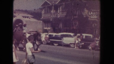 1954: Covered Wagon on Display Walking Down Main Street South Dakota