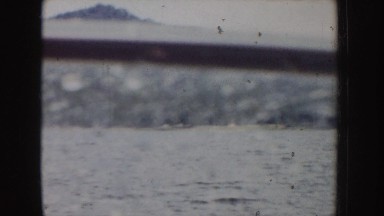 1955: panorama of a rapidly flowing river beneath a mountain range IDAHO
