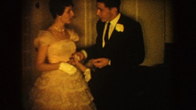 1954: man and woman talking in a building dressed in formal attire SOUTH DAKOTA