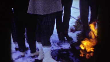 1955: people in the winter enjoying a fire together IDAHO