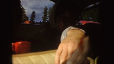 1955: a family enjoying food inside a car parked on the roadside IDAHO