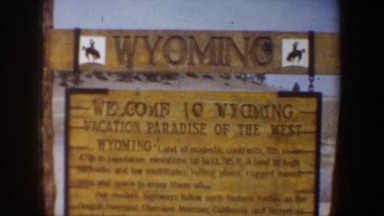 1957: sign: 'wyoming, vacation paradise of the west' with an explanation WYOMING