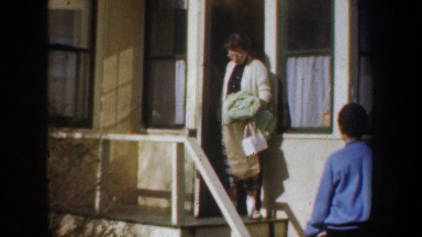 1957: women in dresses exiting the house WYOMING