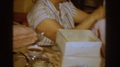 1955: christmas at grandma's house, with her opening presents. IDAHO