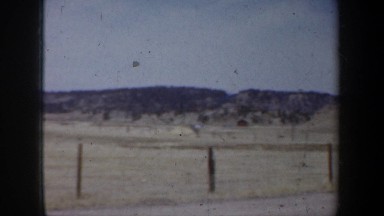 1957: the view of a few bushes changes quickly to dry grass WYOMING