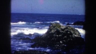 1957: a woman walking barefoot on the rocks SAN FRANCISCO CALIFORNIA