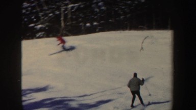 1962: three people skiing down a snowy hill that are following each other in a