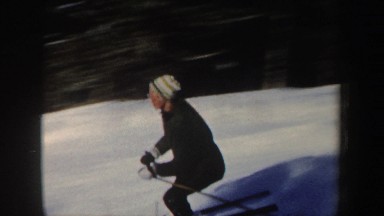 1962: a woman skiing in nature past some forest NEW HAMPSHIRE