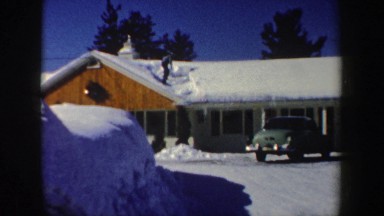 1962: shoveling snow off of a building roof NEW HAMPSHIRE