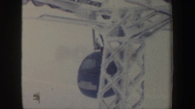 1962: two people in different colored cars riding on a zip line NEW HAMPSHIRE