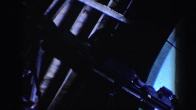 1962: from below shot of machinery in warehouse setting. VERMONT