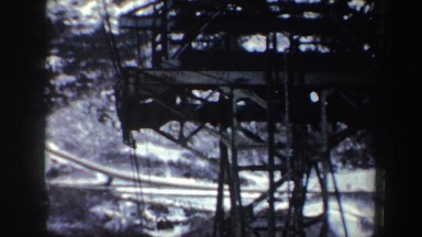 1962: a view while riding on a gondola shows the tower and the forest below NEW