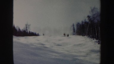 1962: seven men dangerously skiing simultaneously down a steep snowy hill at