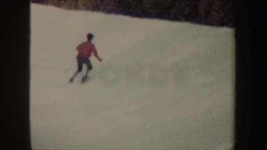 1962: Two Individuals Skiing Down Hillside in New York