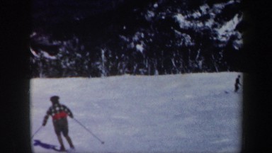 1962: several people skiing down the slope of a mountain VERMONT