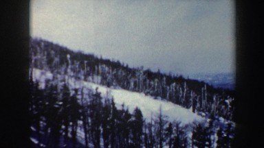 1962: slope of a very high mountain, covered with pines and snow VERMONT