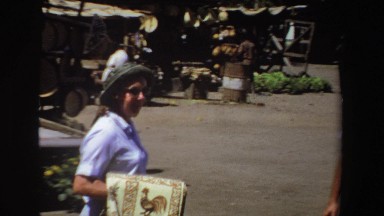 1969: man and woman walking and looking around a small town. SOUTH AFRICA