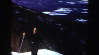 1962: a man skating down the hill covered under the ice VERMONT