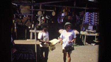 1969: Woman Grabbing Blanket and Searching for Someone in South Africa