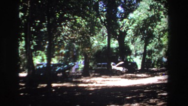 1969: Jeep with Hood Up Among Trees in Camping or Picnicking Area