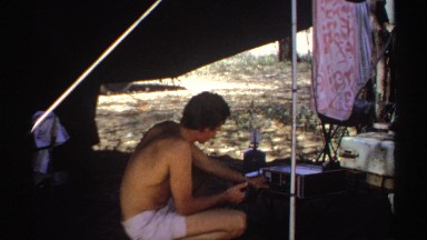 1969: the man try to play some music into the tent SUDAN