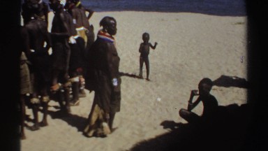 1969: african children learning the traditions of the tribe passed down from the