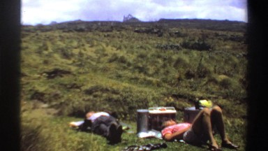 1969: two people enjoy a relaxing nap in a field. SUDAN