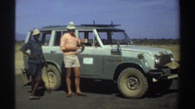 1969: taking a break from safari, accompanied by local people and using the