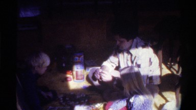 1975: A Family of Three Putting Together a Puzzle in Florida