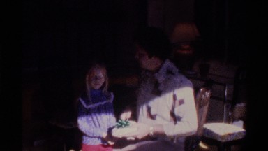 1975: Man Giving Gift and Kiss to a Girl Child Florida