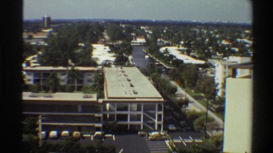 1975: multi-story buildings with cars parked in front of it in a city FLORIDA