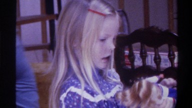 1975: child playing with her doll,watching so nice FLORIDA