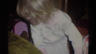 1973: a blonde toddler plays with a new doll that looks like her alot NEW YORK