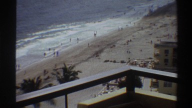 1975: looking down at a beach from several floors up at a busy coastline FLORIDA