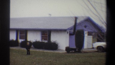 1973: white house and kids in yard NEW YORK
