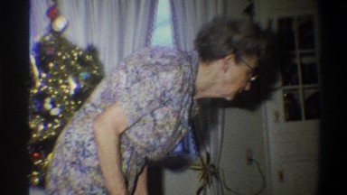 1973: a grandma in front of a christmas tree making a gesture NEW YORK