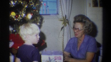 1973: a mom presented a gift to her son on x-mas festival with happiness NEW