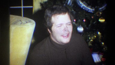 1973: Stuffed Yellow Chair Man Speaks Near Christmas Tree in New York