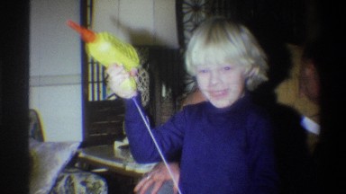 1973: blonde boy plays with pull string toy NEW YORK