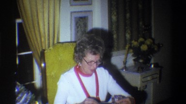 1973: a woman opening a present NEW YORK