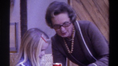 1975: a grandmother and granddaughter playing with dolls FLORIDA