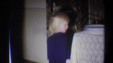 1973: two children standing at a table before dinner NEW YORK
